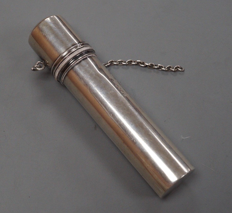 A Victorian silver cylindrical cased portable travelling candle holder with cover and spring mechanism, Wright & Davies, London, 1869, with suspension chain, 11.3cm
